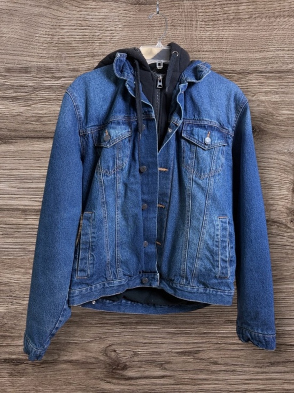 Levi’s signature denim trucker jacket with built-in hoodie. Medium.